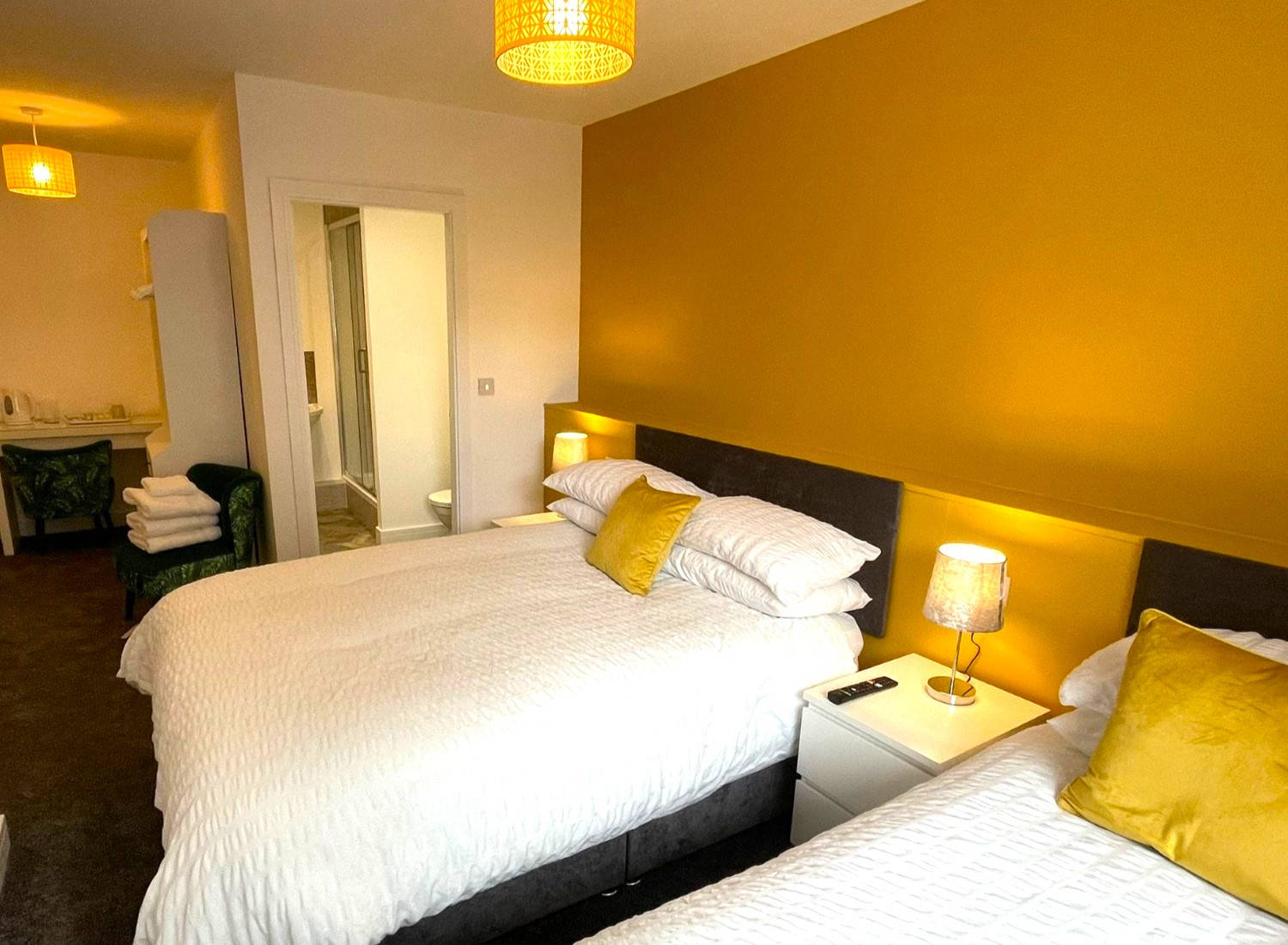 Family room with a double and single bed with private bathroom